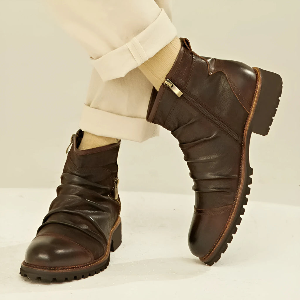 Black mid-calf cowboy boots with side zip and embossed leather texture