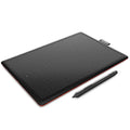 Wacom CTL-472 digital drawing tablet with pressure-sensitive pen and replacement nibs on a desk