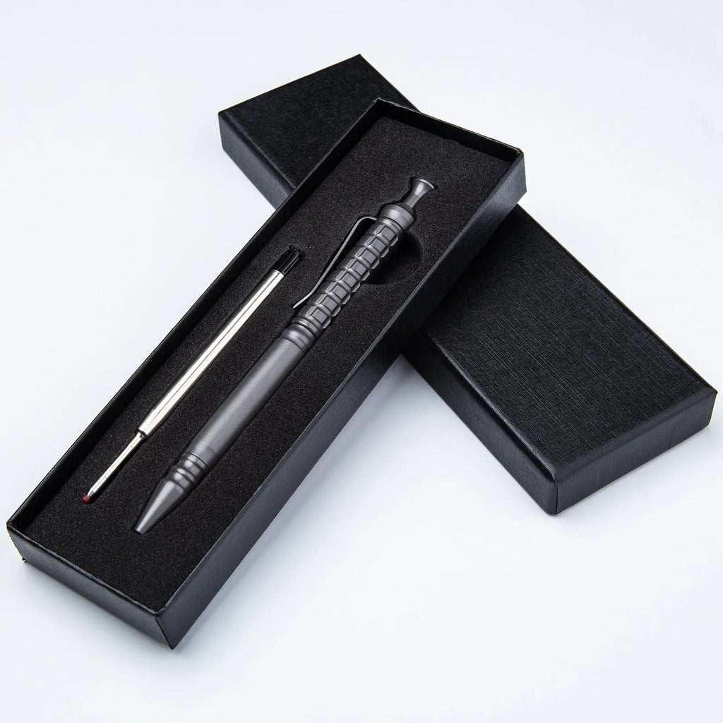 Gunmetal grey titanium alloy tactical pen with push-action button, shown in its gift box.