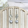 French micro inlaid diamond pearl hook earrings in gold finish