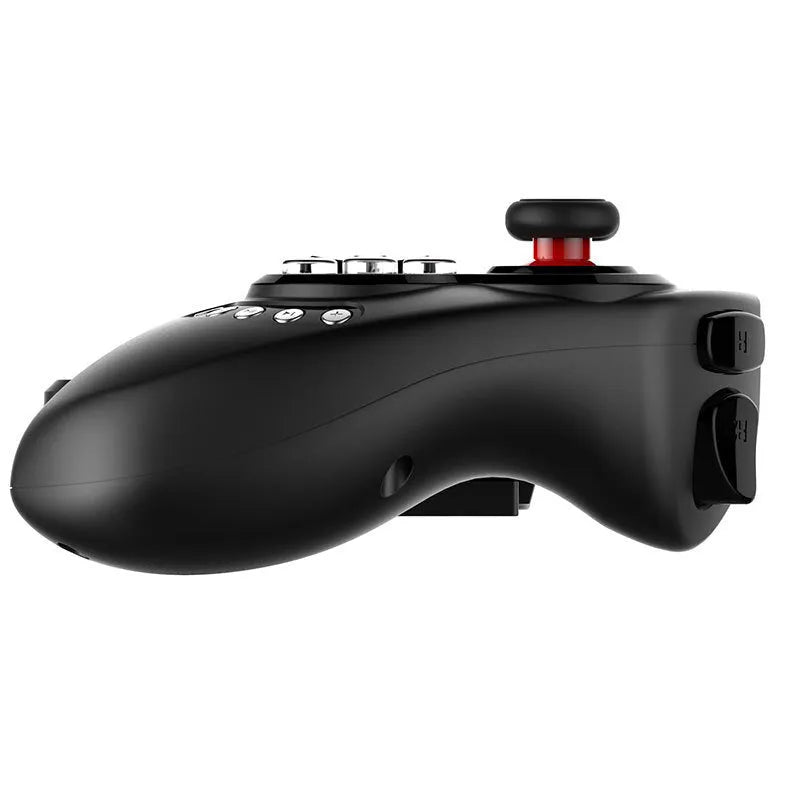 Black telescopic wireless game controller extended holding a mobile phone