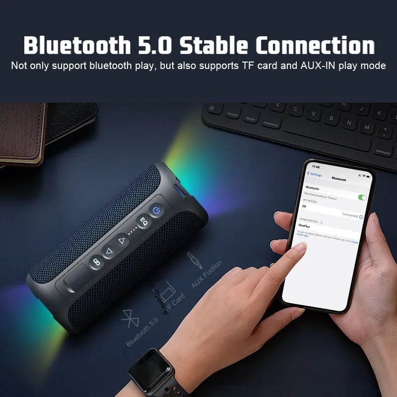 Black and blue fabric-covered wireless Bluetooth speaker with LED lights showing 40W power rating