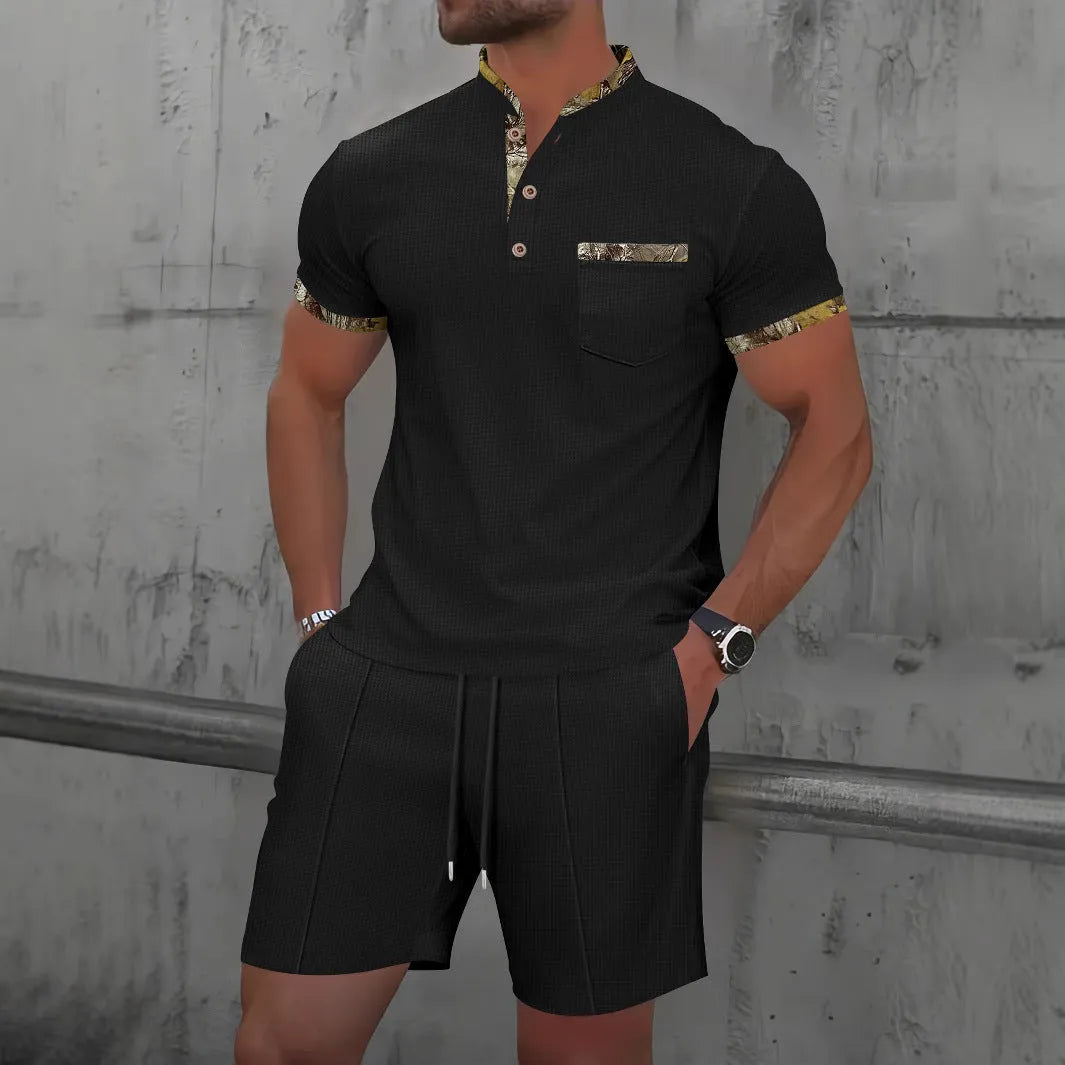 Man wearing a grey waffle-textured zip polo short sleeve top and matching shorts from a two-piece suit set.