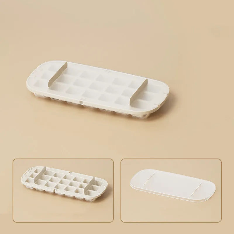 High-capacity plastic ice cube tray grid in blue colour with an ice shovel stored in its side compartment.