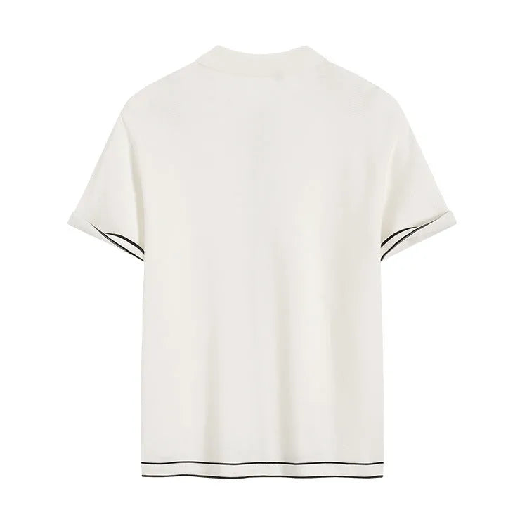 White short-sleeve women's V-neck cardigan with dark contrasting lapels laid flat.