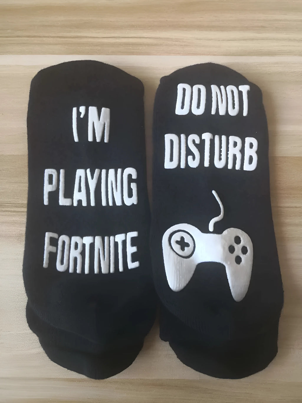 Cotton dispensing socks with 3D letter print, shown in black, blue, and white, with short, medium, and long tube lengths