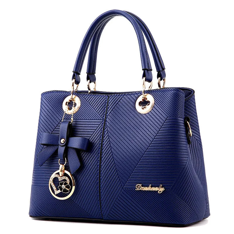 Retro style PU leather handbag with zipper opening and shoulder strap in multiple colours.