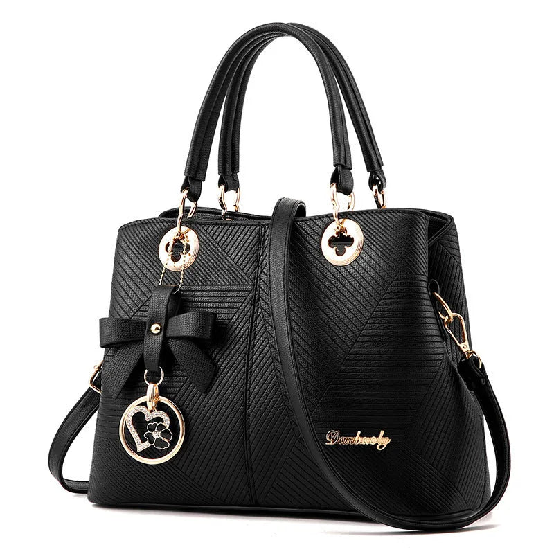Retro style PU leather handbag with zipper opening and shoulder strap in multiple colours.