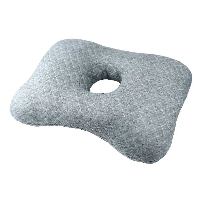 Beauty salon single hole ear pillow in Boer Grey colour on a treatment bed.