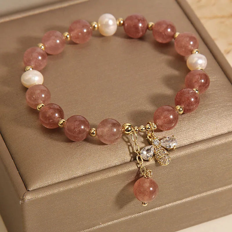 Women's bracelet with strawberry quartz beads, freshwater pearls, and zircon crystals on gold-tone clasp