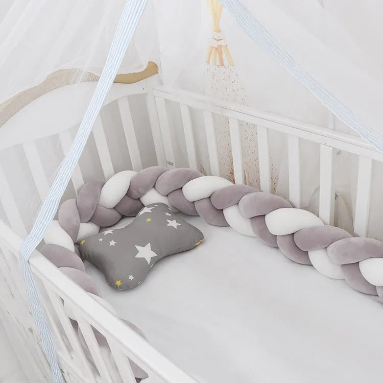 Spandex crystal velvet baby cot bumper in grey pink colour, shown flexible and long.