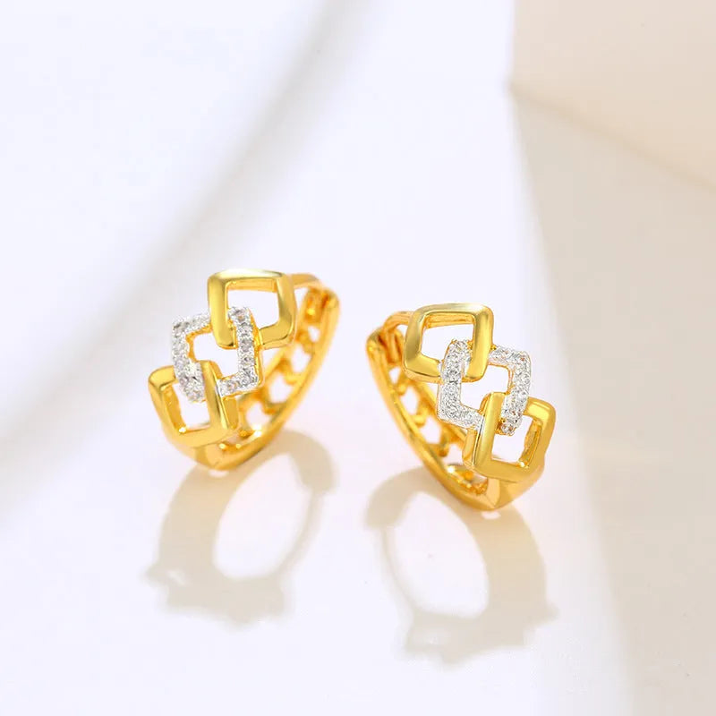 Gold tone geometric hollow-out drop earrings with colour separation clip design