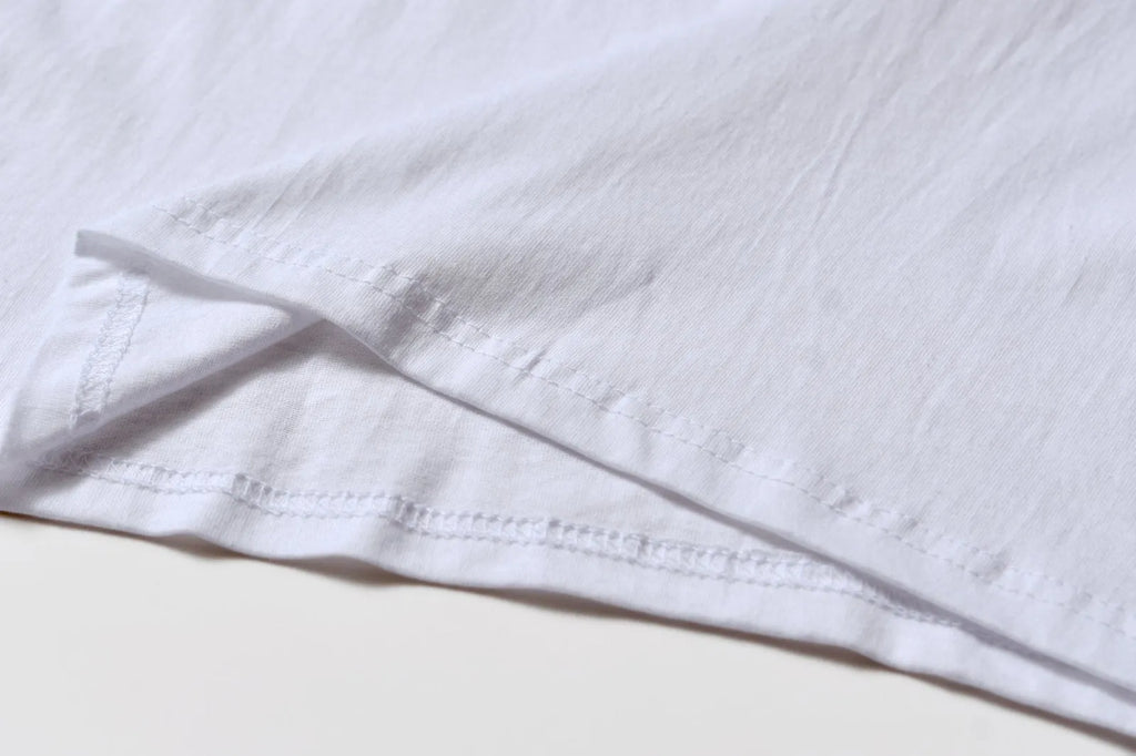 White cotton pattern overalls with short sleeves and loose pullover style