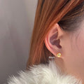 Pearl stud earrings with geometric star design in silver, showing size options from 8mm to 14mm diameters