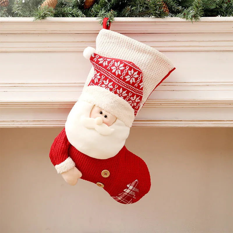 Large red and white knitted Christmas stocking with Santa Claus design hanging on fireplace