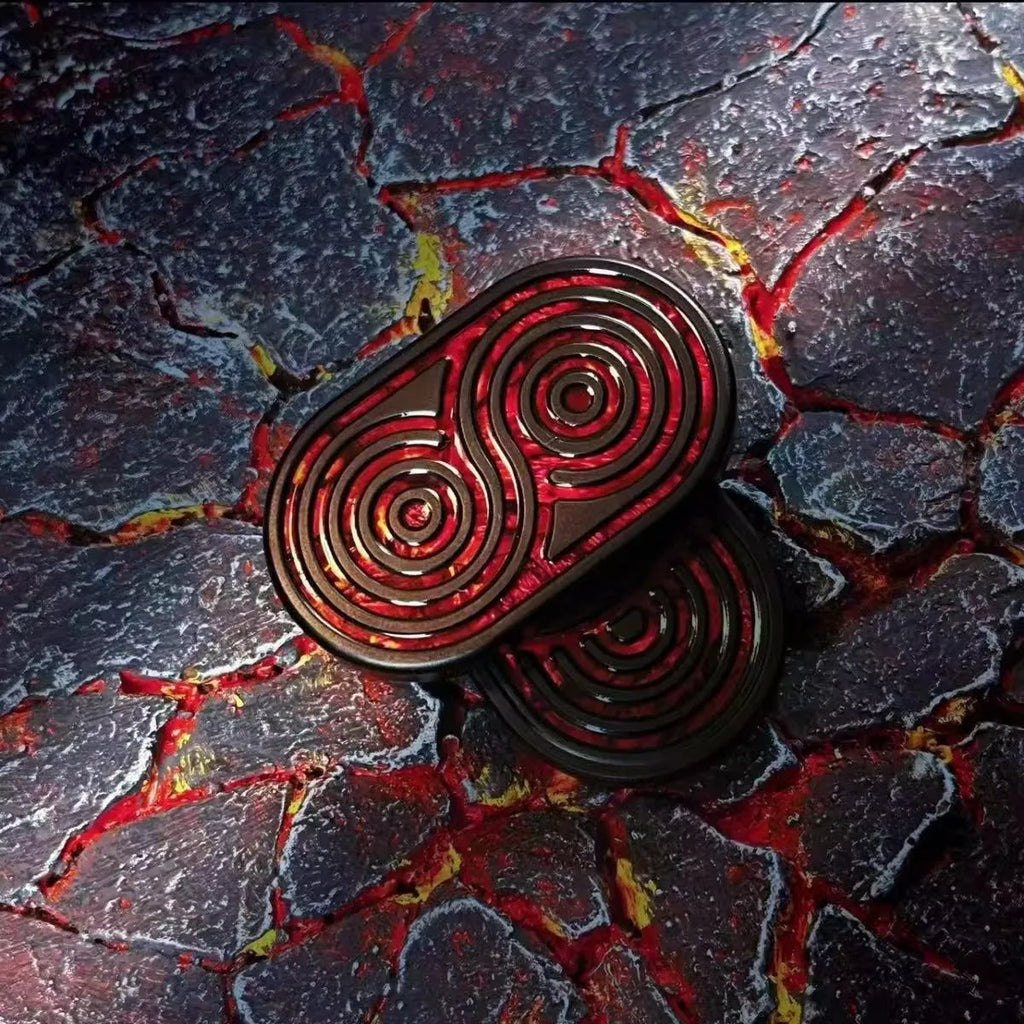 Stainless steel EDC hand push coin fidget toy in Agate Red colour on surface