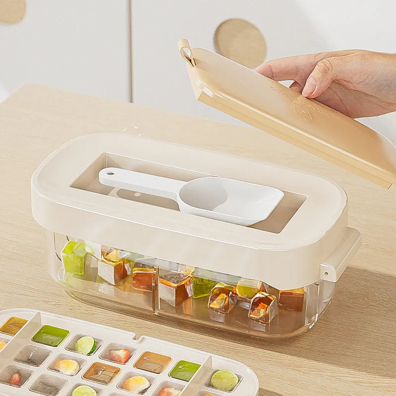 High-capacity plastic ice cube tray grid in blue colour with an ice shovel stored in its side compartment.