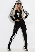 Black women's hoodie and trouser set with wings printing on the fabric.