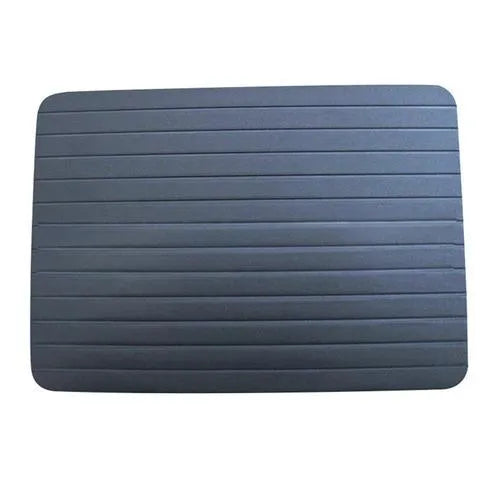 Black aluminium quick defrosting tray for thawing frozen meat and food without electricity.