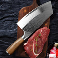 Stainless steel kitchen knife with a 320mm blade on a kitchen counter.