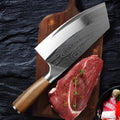 320mm long stainless steel kitchen knife with a sharp blade on a kitchen counter.