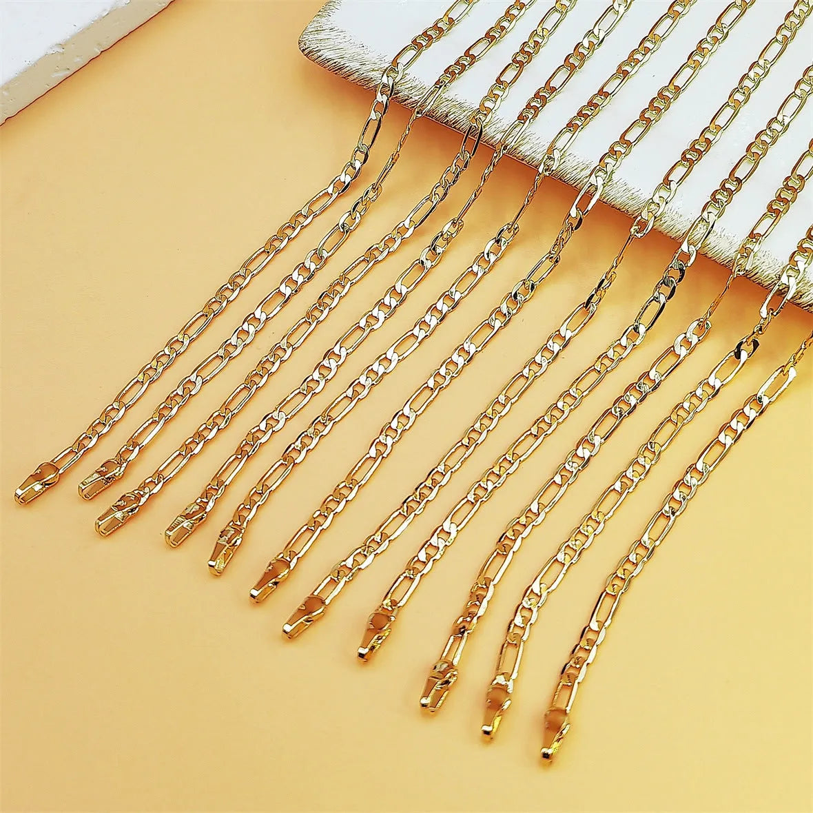 Gold coloured unisex NK chain bracelet with geometric links and 18K real gold plating on copper