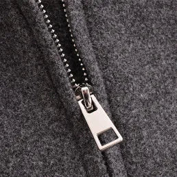 Women's gray PU jacket with shirt-collar, zip front, and long sleeves on a model