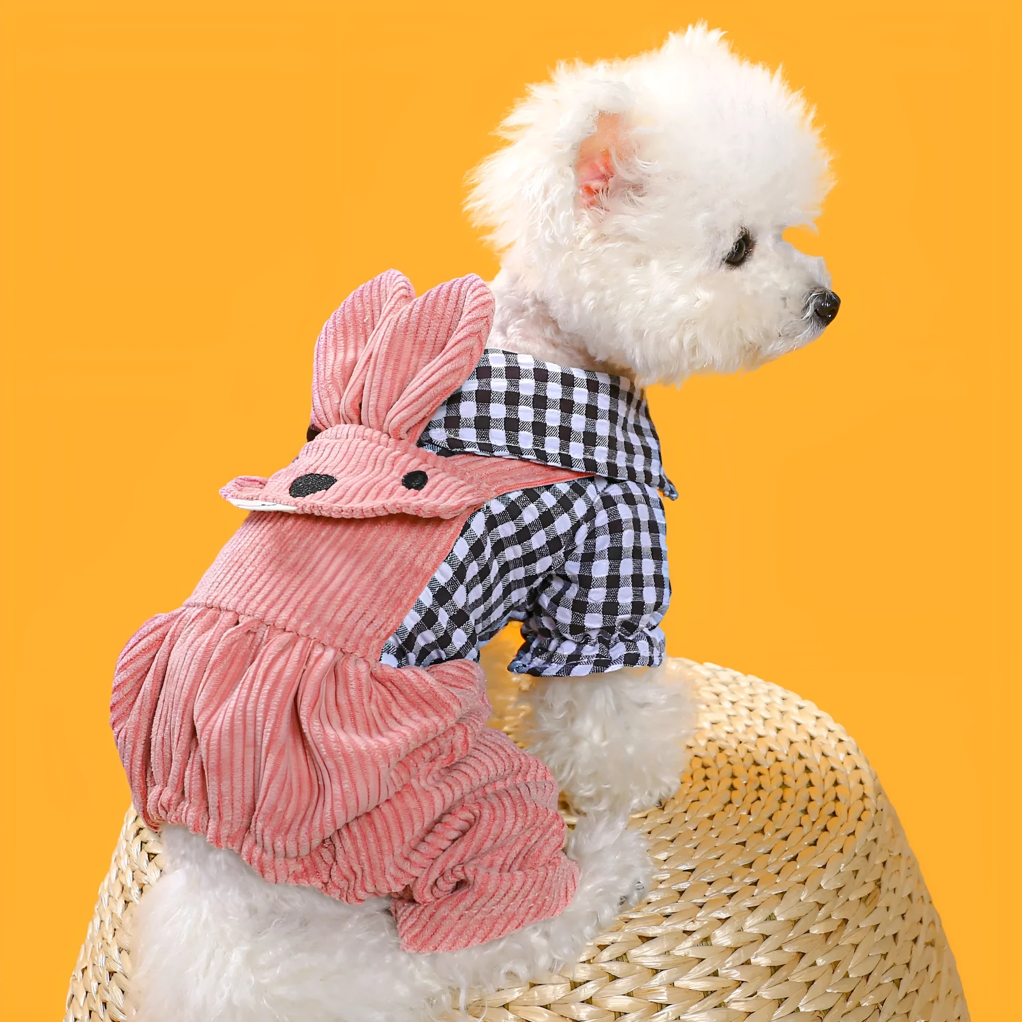 Four-legged plaid polyester pet overalls in black grid top, with full leg coverage, on a light background