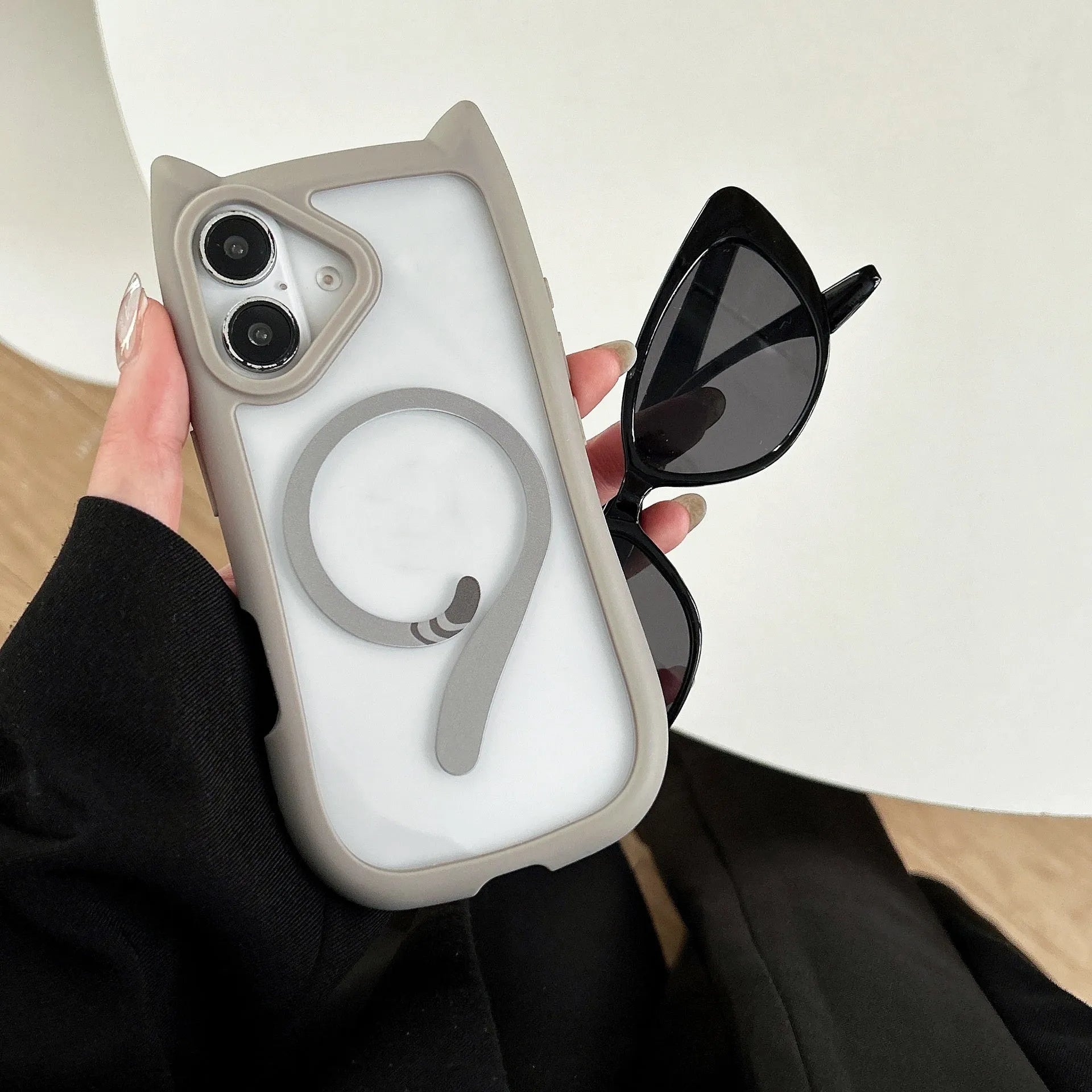 Transparent acrylic and TPU phone case for iPhone 17 models in black, blue, grey, and pink colour options.