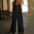 A sleeveless wide-leg cotton jumpsuit in an art retro style, shown in Army Green colour with a pocket and elasticated waist.