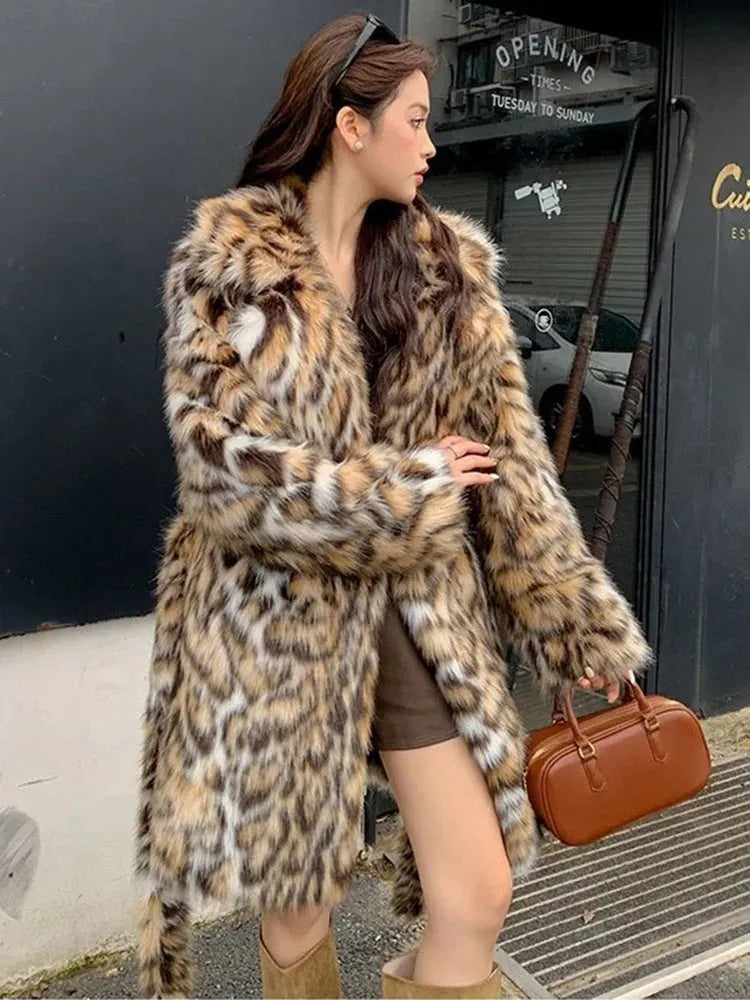 A women's long faux fur coat with a fur collar and pockets, shown in a street fashion style.
