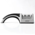 4-in-1 manual kitchen knife sharpener with black and cyan TPR handle, showing sharpening slots.