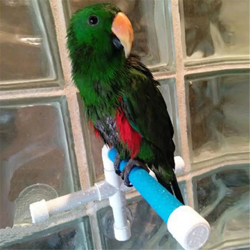 White foldable plastic parrot bath shower stand with three suction cups on a shower wall