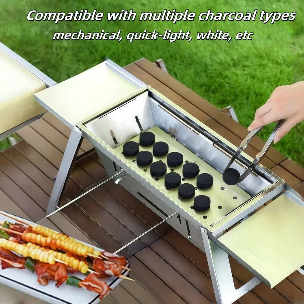 A small, foldable portable charcoal grill for outdoor cooking.