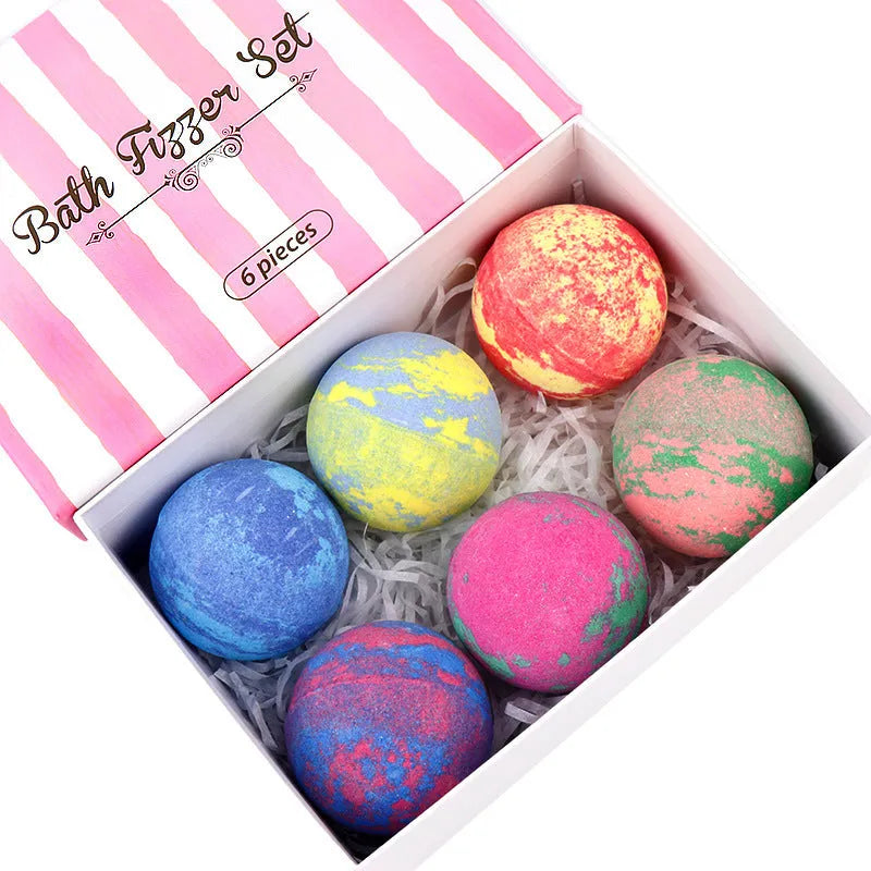 Set of six 60g mixed colour bath salt balls with essential oils and shea butter on a white background