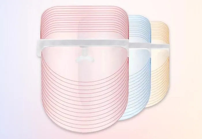 Transparent ABS LED light therapy face mask with red, blue, and yellow lights, 210x175x140mm, 83g, USB phone connection.