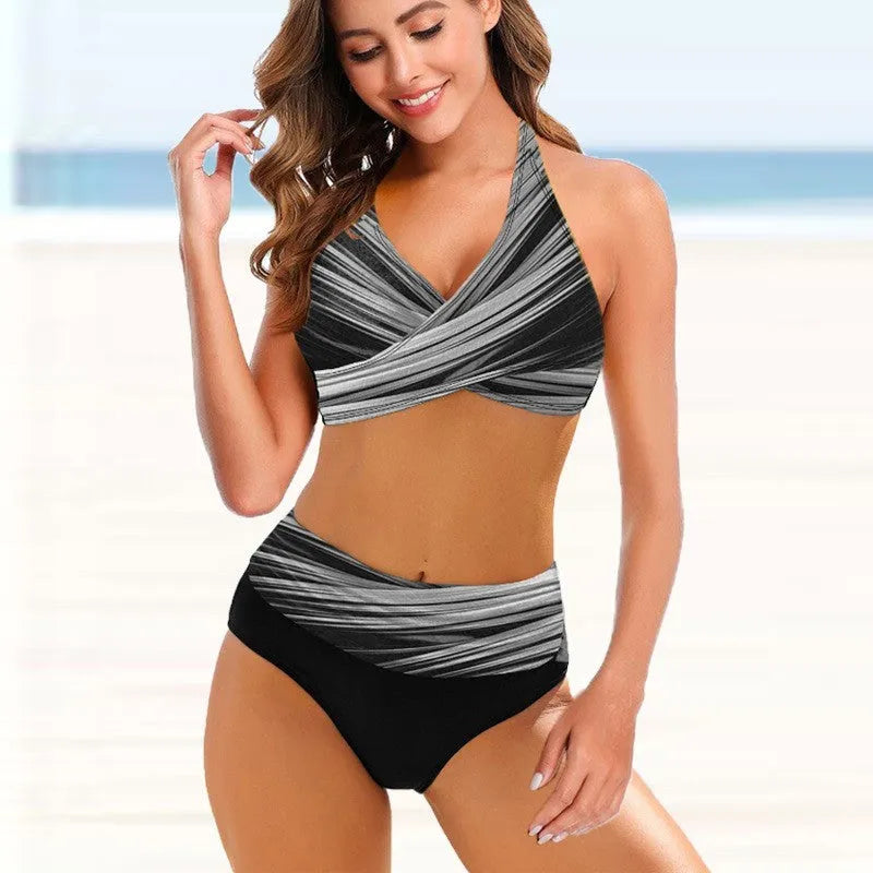 Woman wearing a striped tie-dye hollow bikini with high-waisted briefs and a backless top.