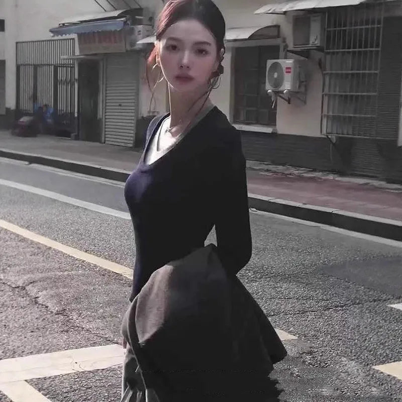 Black Korean style fake two-piece V-neck knitted pullover top on a woman