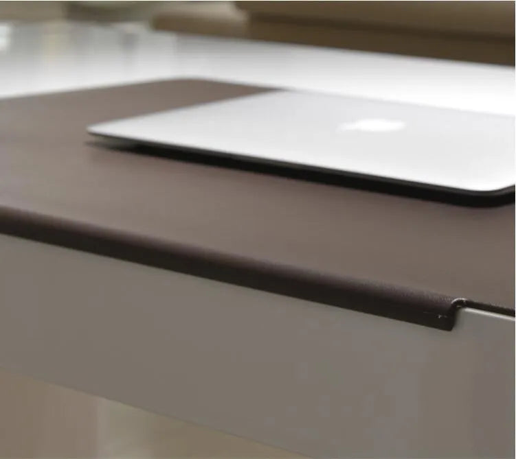 Large PVC computer desk mat 700x450mm in black with non-slip backing on a desk