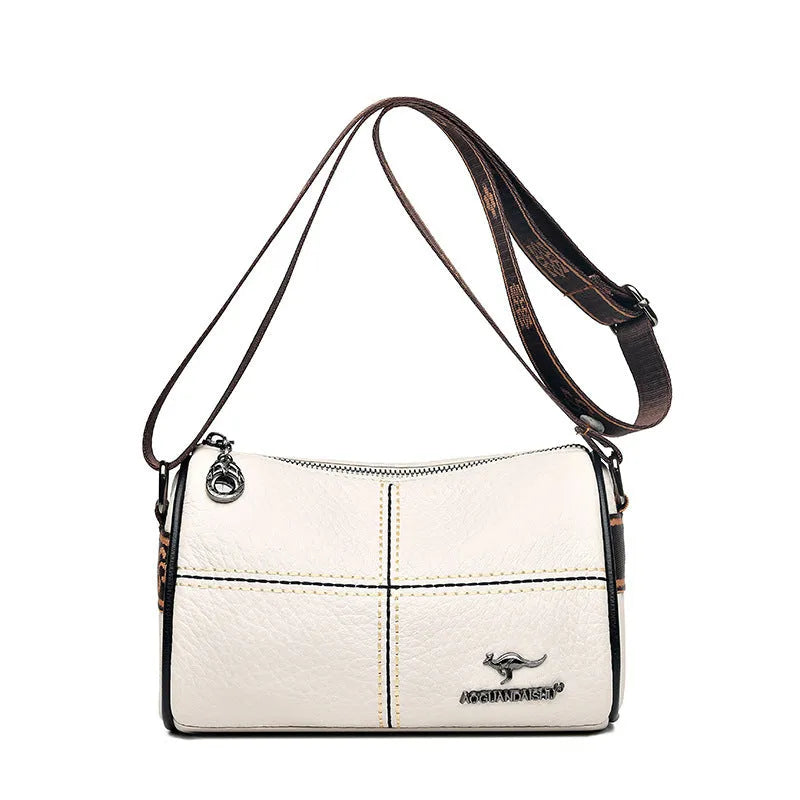 Genuine leather women's cylindrical shoulder bag with stitched patchwork, zip pocket, phone pocket and document pocket