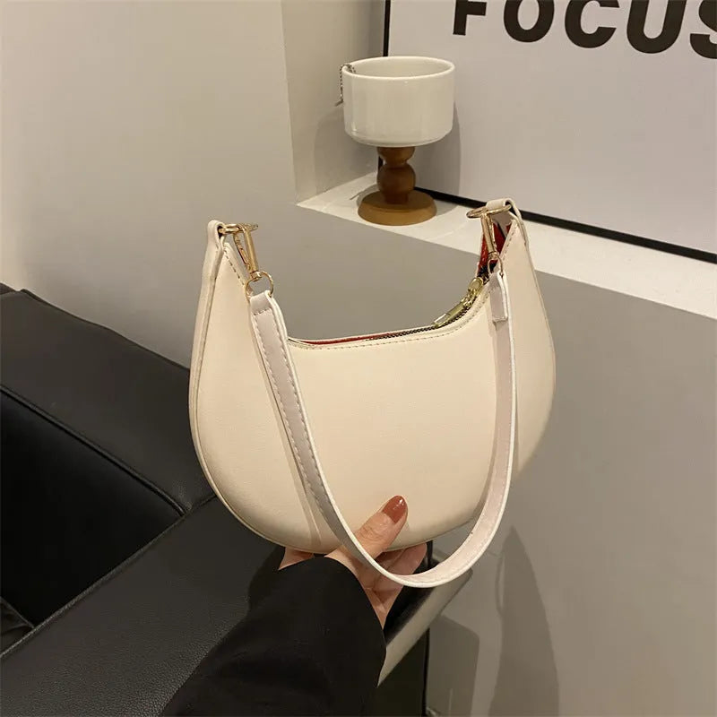Round green one-shoulder underarm bag showing sewing line detailing and sandwich pocket design