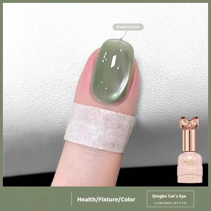 Bottle of micro glass bead cat's eye gel nail polish showing a cat's eye effect swatch.