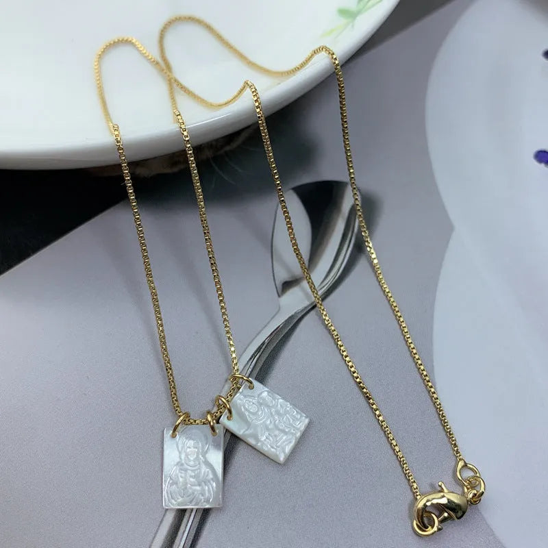 White mother pearl shellfish Jesus Virgin Mary pendant on a 45cm alloy box chain with electroplated white finish