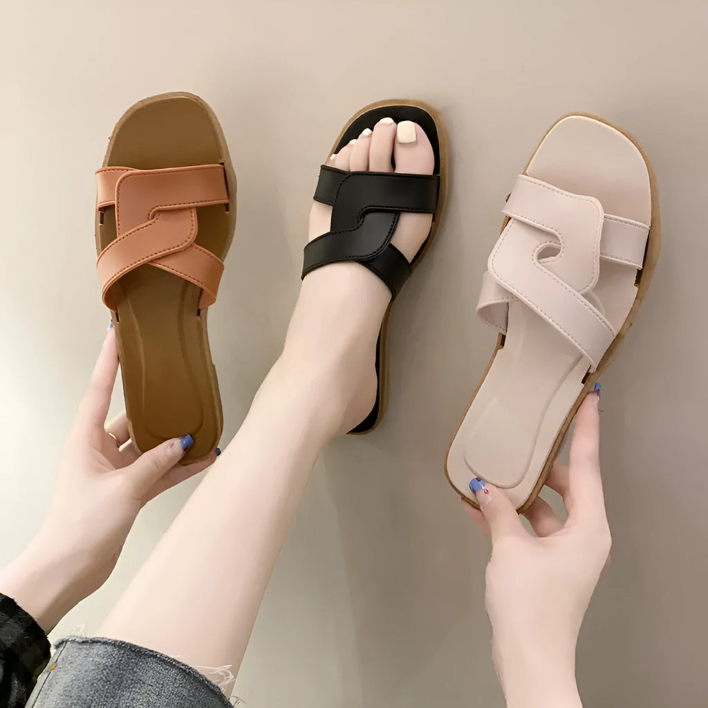 Women's PVC cross strap non-slip sandals in beige white colour on a plain background