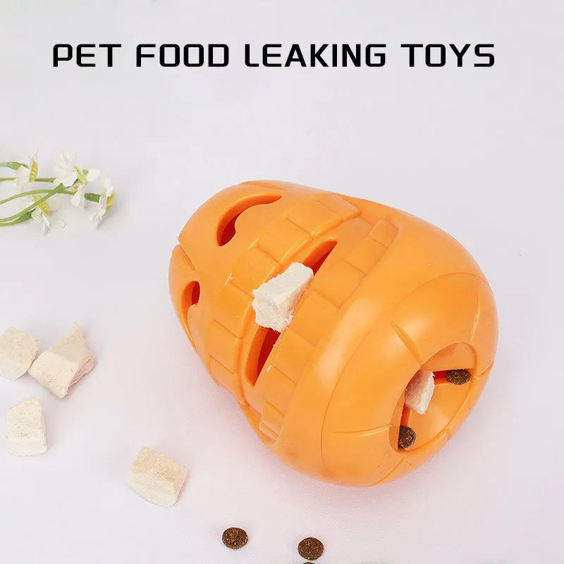 Orange Halloween pumpkin shaped durable thermoplastic rubber dog chew toy with a treat-dispensing funnel.