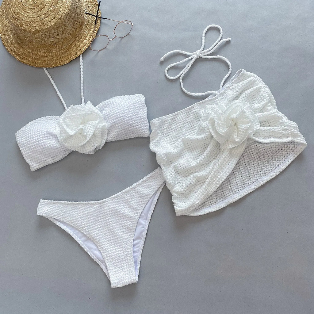 Women's three-piece bikini set with 3D flower split design in purple or white.
