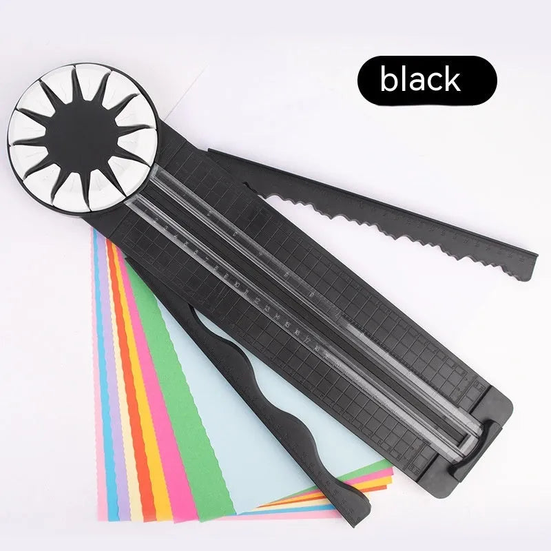 Pink and black 12-in-1 multifunctional plastic paper cutting machine on a desk