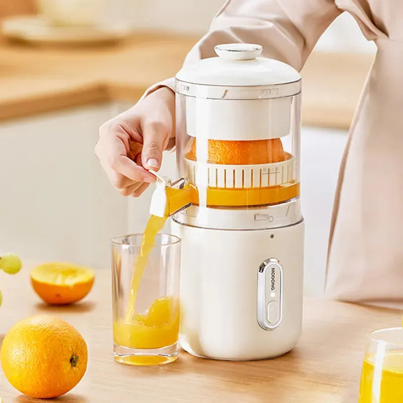 Fresh green portable wireless electric juicer with USB charging port on a kitchen counter.