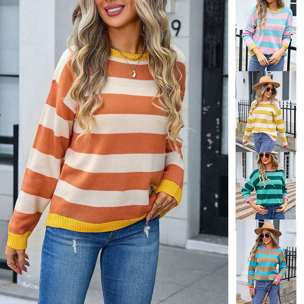 Women's loose blue striped acrylic knit sweater with long sleeves on a hanger.