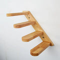Wall-mounted solid wood cat stairs with 4 steps, left-to-right arrangement, on a white wall